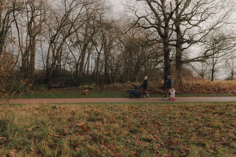 Family walking through Chelmsford park on a slow Sunday morning