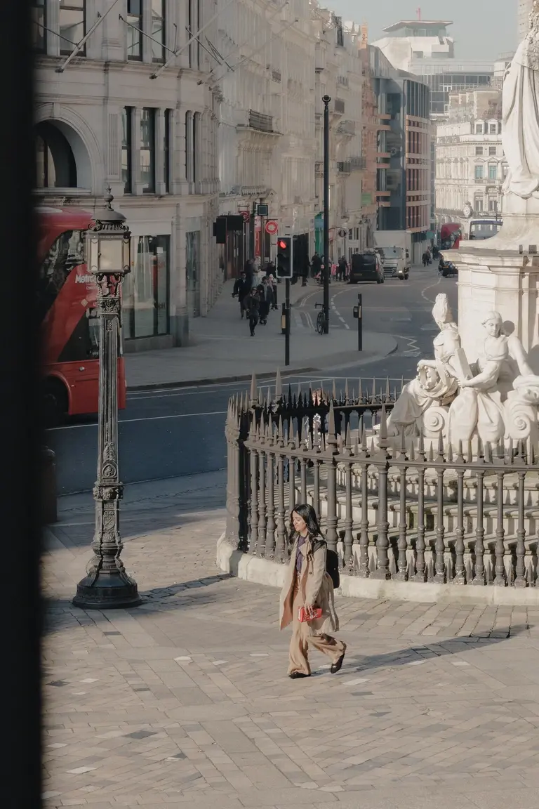 Woman walking past St. Pauls Cathedral