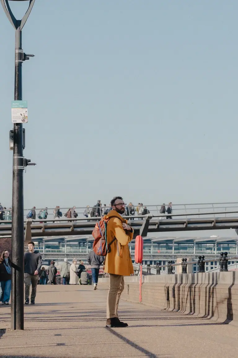 Man stopping next to Shakespeare's Globe