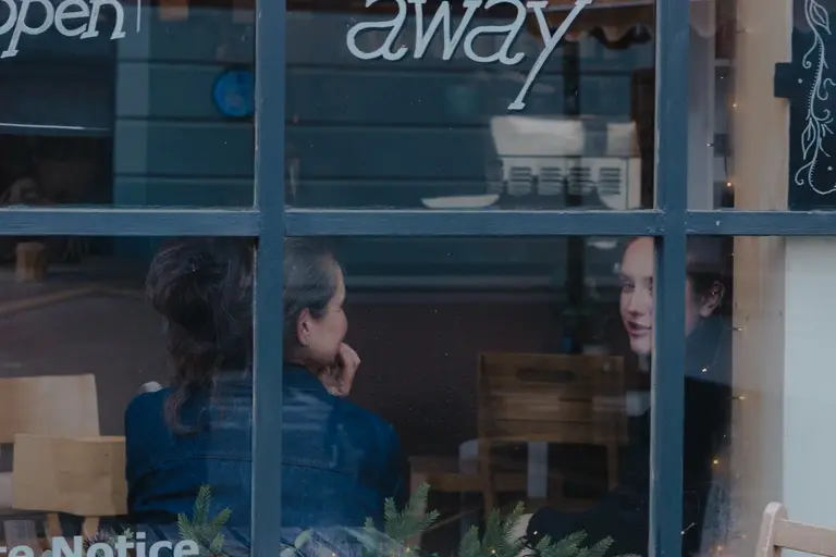 Friends chatting in Sheringham Cafe