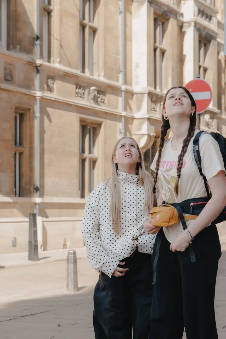 Kids looking up at chapel bells ringing