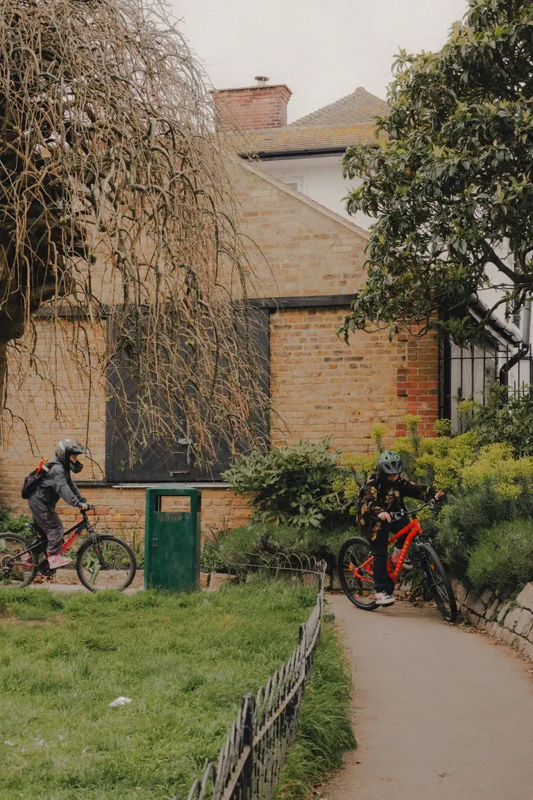 Boys riding their bikes together through Leigh-on-Sea